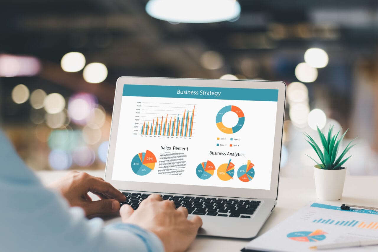 accounting concept. businessman working using a laptop with analyzing finance sales data and economic growth graph chart.